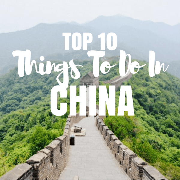 Walking View on the Great wall of China looking down on a valley of trees. Top 10 things to do in China
