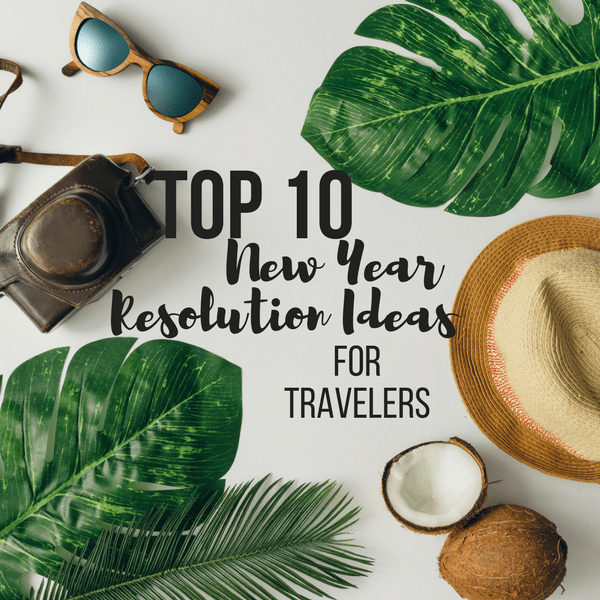 aerial view of a table covered in leaves, coconuts, sunglasses and a hat. top ten new year resolution ideas for travelers.