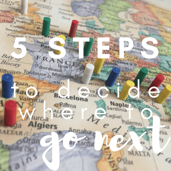 a map covered with pins. 5 steps to decide where to go next