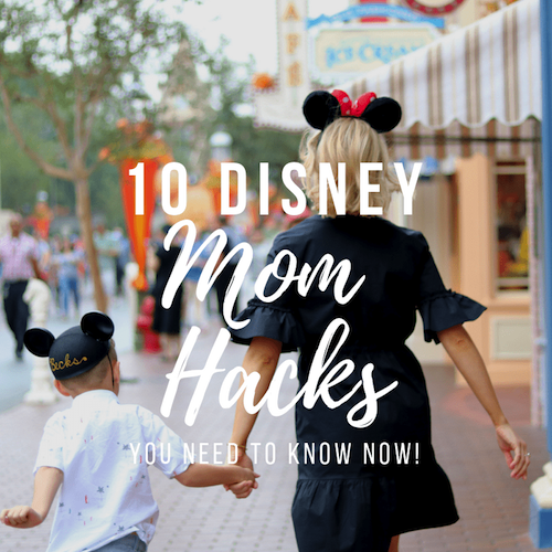 mom and boy holding hands in Disneyland