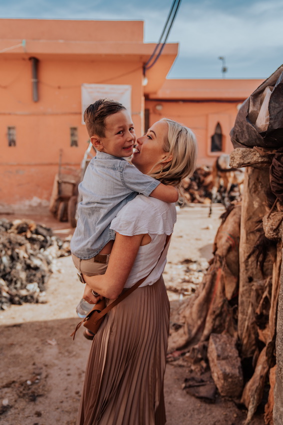 Mom and son hugging in Morocco