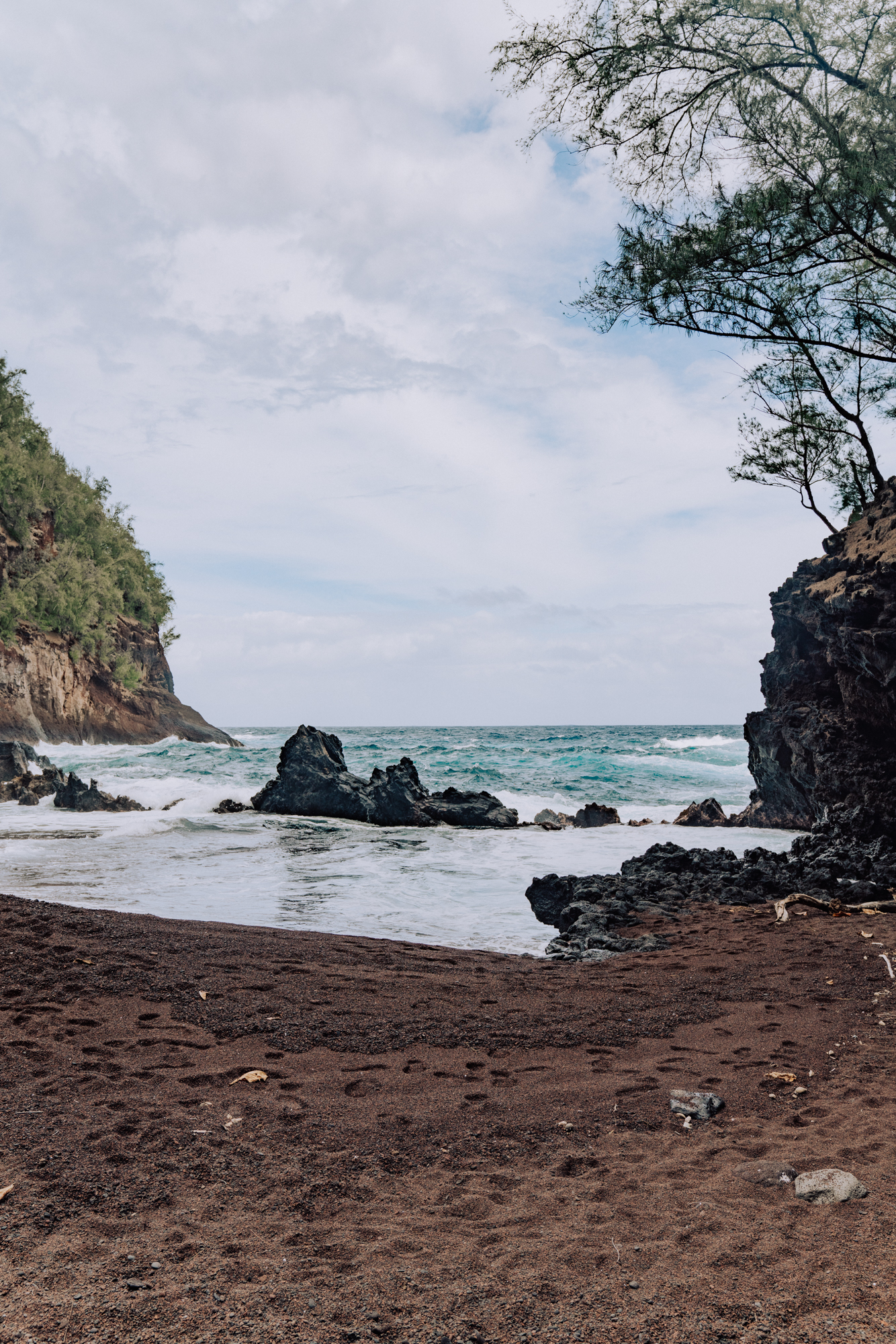 Hawaiian beach with red sand.