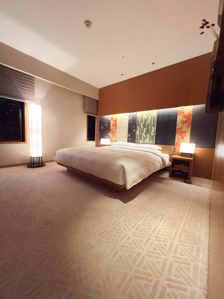 Japanese-style guest room with a kimono-fabric headboard at a Hyatt hotel in Kyoto, Japan