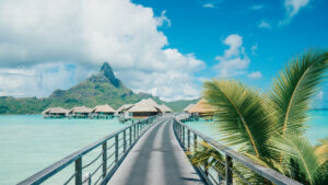 Bora Bora view with bungalows and a palm beach
