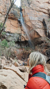 women taking a glaze at zion mountains