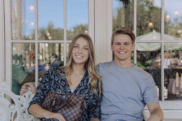 a young couple at disneyworld smiling