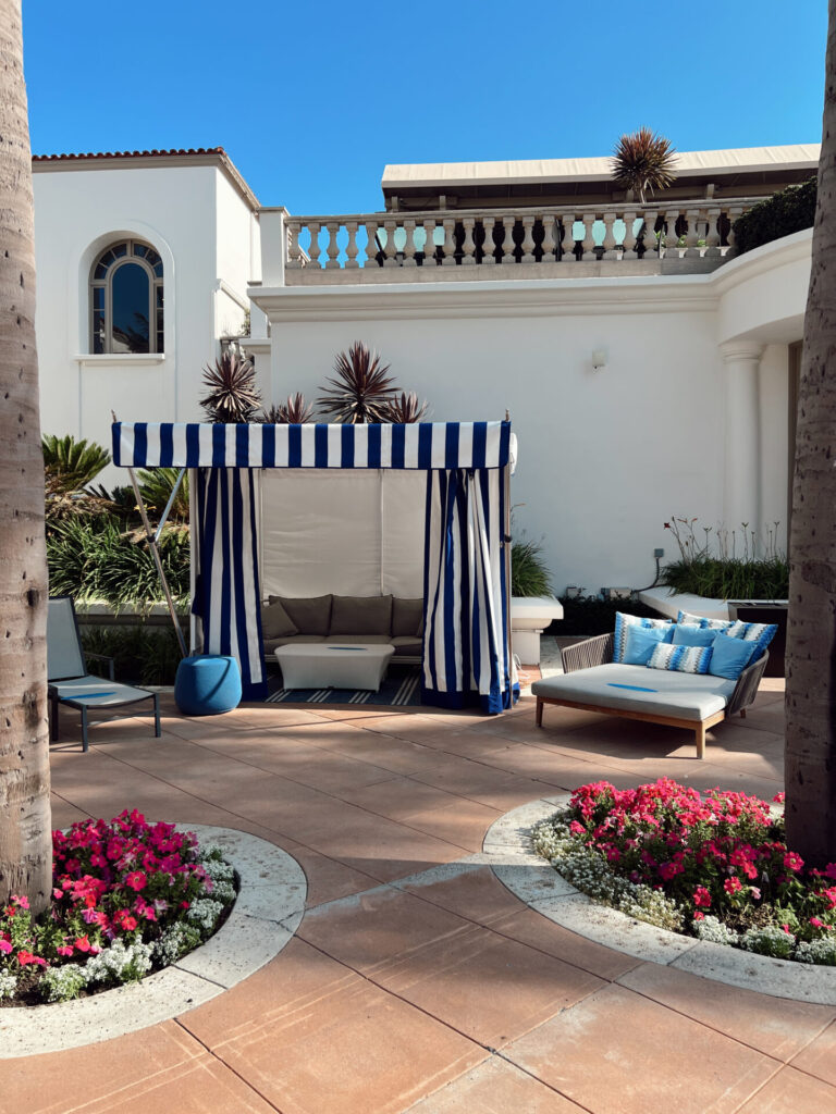 Poolside cabana and lounge seating at a Marriott Bonvoy hotel property booked using the Best Rate Guarantee